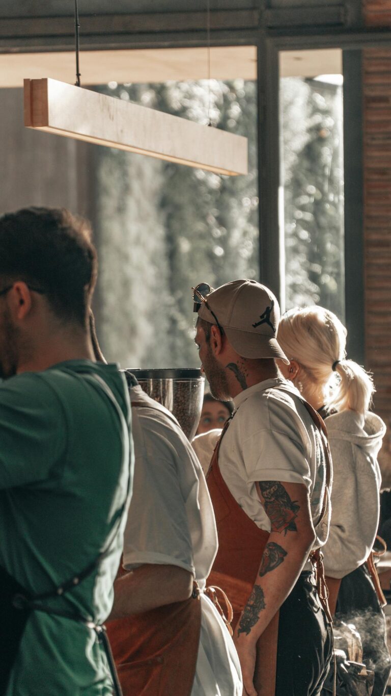 Restaurant staff collaborating in a bustling Istanbul kitchen, silhouette view.